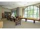 Spacious lounge area with comfortable seating, large windows, and a shuffleboard table at 3040 Peachtree Nw Rd # 713, Atlanta, GA 30305