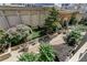 Serene outdoor patio with lush landscaping, a grill, and seating area for relaxation and entertaining at 3040 Peachtree Nw Rd # 713, Atlanta, GA 30305