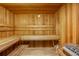Cozy wooden sauna with benches, heater, and a bucket, ideal for relaxation and wellness at 3040 Peachtree Nw Rd # 713, Atlanta, GA 30305