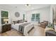Inviting bedroom with plush bed, wood accents, and natural light at 1347 Midlawn Dr, Decatur, GA 30032