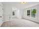Bright bonus room with multiple windows and neutral carpet at 1347 Midlawn Dr, Decatur, GA 30032