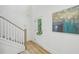 Bright entryway with hardwood floors, white staircase, and a modern front door with glass panels at 1347 Midlawn Dr, Decatur, GA 30032