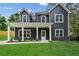 Charming two-story home with a modern gray exterior, white trim, and a welcoming front porch at 1347 Midlawn Dr, Decatur, GA 30032