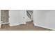 Finished basement with neutral-toned floors, access to a tiled shower, and a stairwell at 1430 Dallas Circle Sw, Marietta, GA 30064