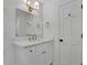 All-white bathroom with new vanity, quartz countertop, gold fixtures and new hardware at 1430 Dallas Circle Sw, Marietta, GA 30064