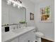 Modern bathroom with quartz vanity, sink, and natural light from the window at 1430 Dallas Circle Sw, Marietta, GA 30064