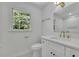 Elegant bathroom featuring new vanity, gold hardware, and a window with a wooded view at 1430 Dallas Circle Sw, Marietta, GA 30064