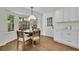 Sunlit breakfast nook with bay window, round table, and hardwood floors at 1430 Dallas Circle Sw, Marietta, GA 30064