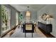 Modern dining room features a large table, designer lighting, and a sleek sideboard at 1430 Dallas Circle Sw, Marietta, GA 30064
