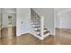 Light and bright foyer with hardwood floors and open staircase at 1430 Dallas Circle Sw, Marietta, GA 30064