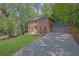 Classic two-story brick home with mature trees and a well-manicured lawn showcasing curb appeal at 1430 Dallas Circle Sw, Marietta, GA 30064