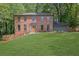 Brick home with a beautiful lawn, a two-car garage and an elegant front entryway at 1430 Dallas Circle Sw, Marietta, GA 30064
