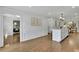 Open-concept kitchen with island, adjoining dining area, and hardwood floors at 1430 Dallas Circle Sw, Marietta, GA 30064