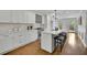 Bright kitchen features white cabinets, island with bar seating, and modern appliances at 1430 Dallas Circle Sw, Marietta, GA 30064