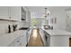Sleek white kitchen boasts stainless steel appliances and a spacious island at 1430 Dallas Circle Sw, Marietta, GA 30064