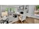Cozy living room featuring custom built-ins, a fireplace, and a bay window at 1430 Dallas Circle Sw, Marietta, GA 30064