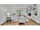 Bright living room with fireplace, built-in bookshelves and a large bay window at 1430 Dallas Circle Sw, Marietta, GA 30064
