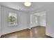 Bright living room with gleaming hardwood floors and natural light from a double paned window at 1430 Dallas Circle Sw, Marietta, GA 30064