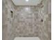 Enclosed shower with modern tile, a niche for toiletries, and a rain shower head at 1430 Dallas Circle Sw, Marietta, GA 30064