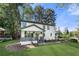 Charming two-story home with a welcoming front porch and a freshly landscaped front yard at 2111 Holly Hill Dr, Decatur, GA 30032