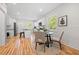 Kitchen view showcasing stainless steel appliances, a central island with bar seating, and a round dining table with chairs at 2111 Holly Hill Dr, Decatur, GA 30032