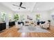 Bright living room with hardwood floors, neutral decor, and plenty of natural light at 2111 Holly Hill Dr, Decatur, GA 30032