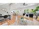 Open-concept living area with hardwood floors, connecting seamlessly to the kitchen and dining area at 2111 Holly Hill Dr, Decatur, GA 30032