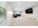 Large basement with plush carpeting, and a comfortable seating area perfect for entertaining at 5027 Castlewood Sw Dr, Lilburn, GA 30047