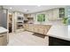 Updated kitchen with stainless steel appliances, countertops, and plenty of natural light at 5027 Castlewood Sw Dr, Lilburn, GA 30047