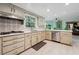 Well-lit kitchen featuring ample cabinet space, modern appliances, quartz countertops, and a stylish backsplash at 5027 Castlewood Sw Dr, Lilburn, GA 30047