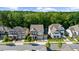 Aerial view showcases houses in a neighborhood surrounded by lush greenery and trees at 10140 Grandview Sq, Duluth, GA 30097