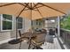 Inviting back deck with a large umbrella, outdoor seating, and space for entertaining at 10140 Grandview Sq, Duluth, GA 30097