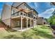 Spacious backyard with a deck and covered patio, ideal for outdoor living and entertaining at 10140 Grandview Sq, Duluth, GA 30097