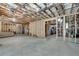 Expansive unfinished basement with visible framing, offering potential for various layouts at 10140 Grandview Sq, Duluth, GA 30097
