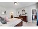 Bedroom with ensuite bath and walk-in closet with custom closet system at 10140 Grandview Sq, Duluth, GA 30097