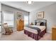 Cozy bedroom with carpet flooring, neutral walls, and large windows at 10140 Grandview Sq, Duluth, GA 30097