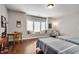 Bright bedroom features two twin beds, a window seat, and hardwood floors at 10140 Grandview Sq, Duluth, GA 30097
