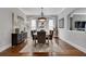 Spacious dining room featuring hardwood floors, a neutral color palette, and an elegant chandelier at 10140 Grandview Sq, Duluth, GA 30097