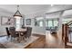 Dining room with wood floors, classic furnishings and a view to the Living Room at 10140 Grandview Sq, Duluth, GA 30097