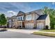 Attractive two-story home with stone accents and a three-car garage at 10140 Grandview Sq, Duluth, GA 30097