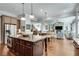 Open-concept kitchen island with barstool seating and stainless appliances at 10140 Grandview Sq, Duluth, GA 30097