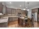 Spacious kitchen features a large center island, stainless appliances and custom cabinets at 10140 Grandview Sq, Duluth, GA 30097