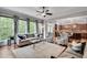 Living room with backyard view featuring a large kitchen, neutral tones, and comfortable seating at 10140 Grandview Sq, Duluth, GA 30097
