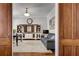 Spacious living room with a built-in shelving unit, sofa and doorway entrance at 10140 Grandview Sq, Duluth, GA 30097