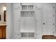 Well-organized mudroom with built-in storage, hooks, and a bench at 10140 Grandview Sq, Duluth, GA 30097