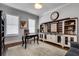 Bright home office featuring a wooden desk, custom shelving and a large window for natural light at 10140 Grandview Sq, Duluth, GA 30097