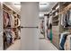 Large walk-in closet with ample shelving and hanging space for organized storage at 10140 Grandview Sq, Duluth, GA 30097