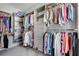 Spacious walk-in closet with custom built-in shelving and hanging racks at 10140 Grandview Sq, Duluth, GA 30097