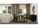 Contemporary dining room with a rustic wooden table, black chairs, and modern decor at 2425 Livi Ln, Buford, GA 30519