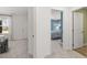 Hallway view into a bedroom, which features a large window and natural light at 2425 Livi Ln, Buford, GA 30519